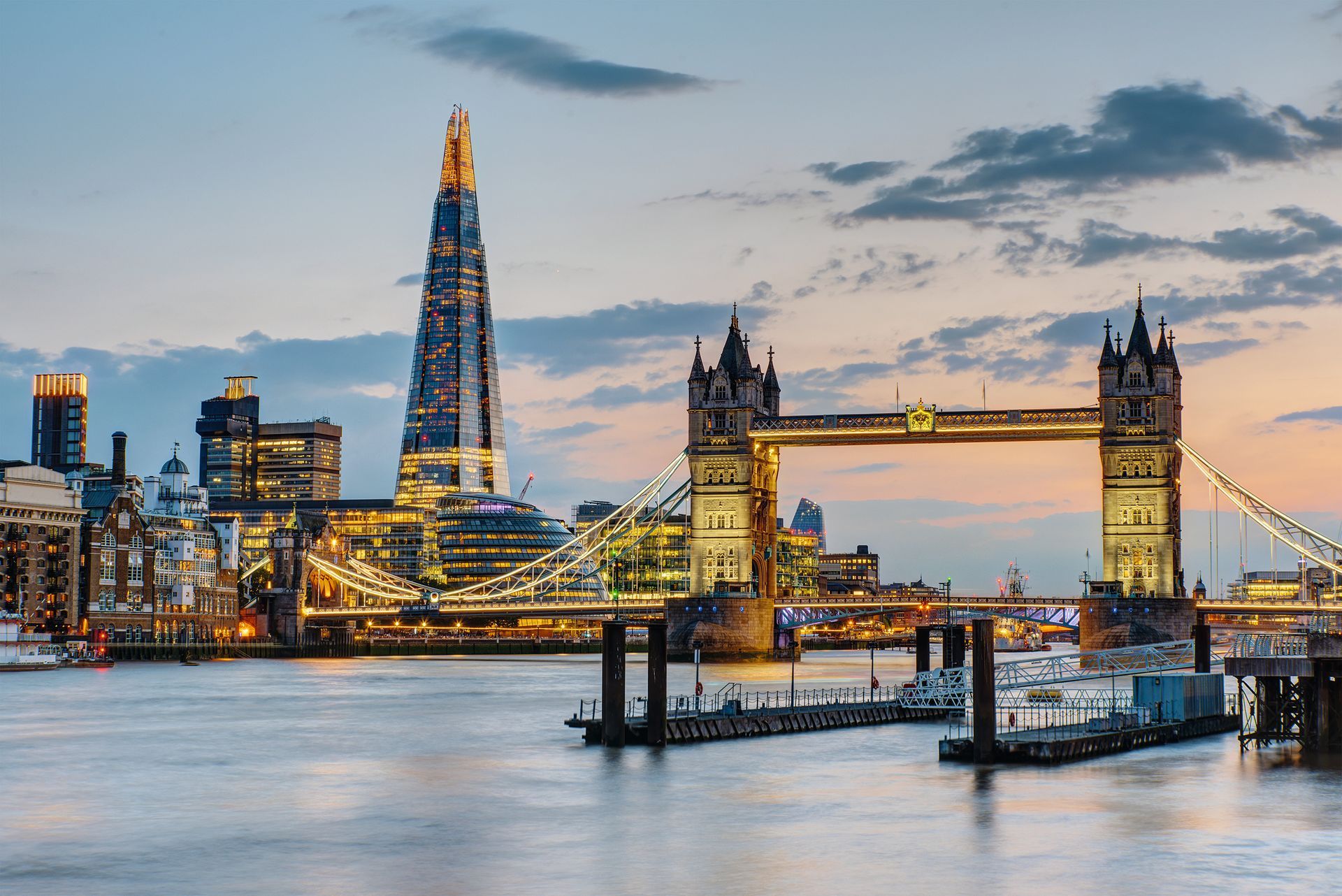 The Tower Bridge in London after sunset with the Shard in the ba