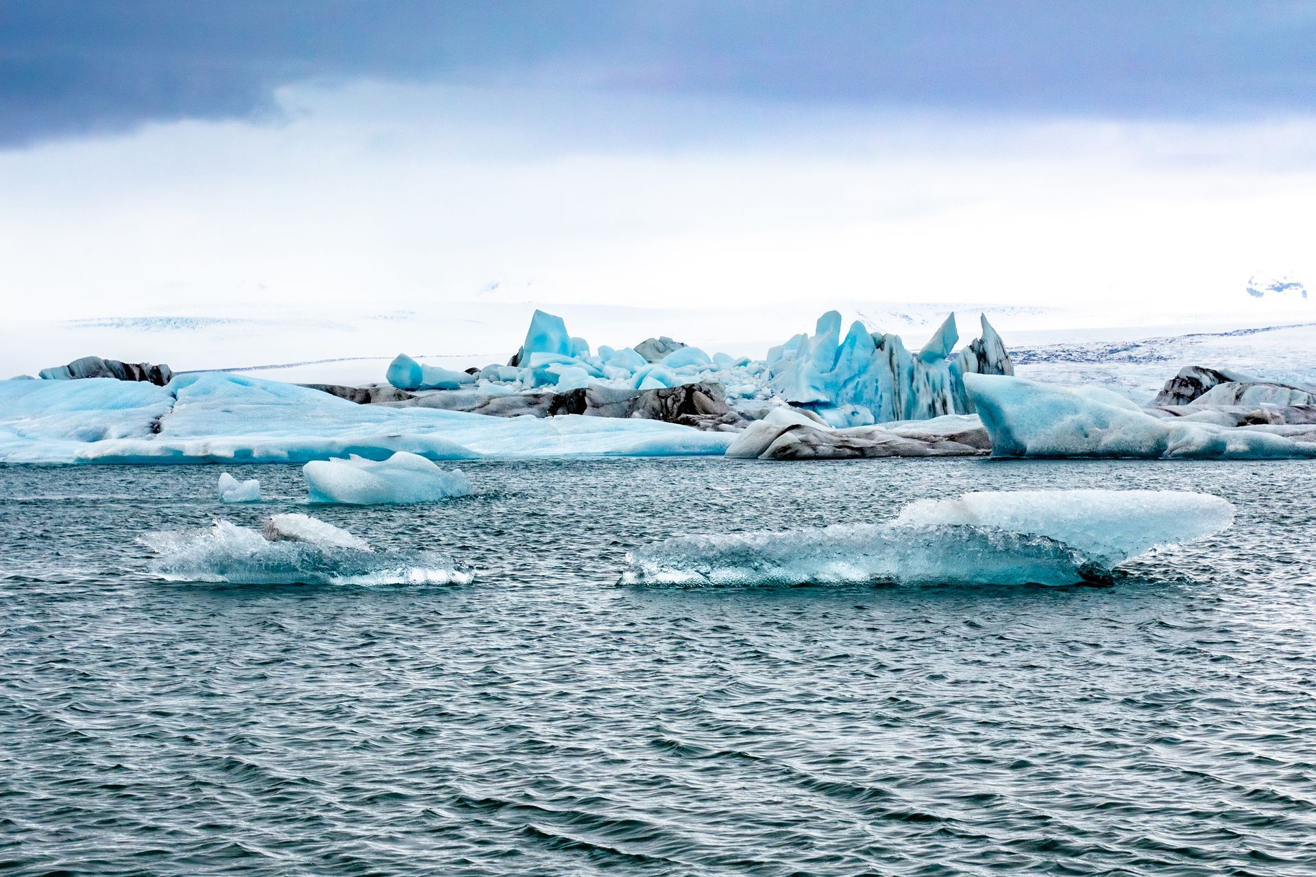 Old blue ice of trapped Icebergs floating in the inland lagoon, Jökulsárlón, Iceland