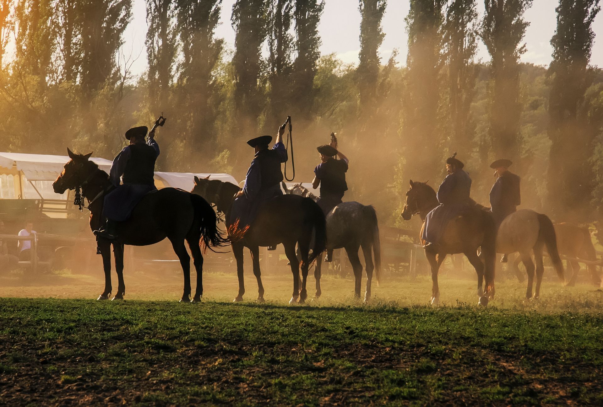 Hungarian horseman ride five horses. He wears the traditional Hungarian national costume for the horse show, SALFÖLD, HUNGARY - AUGUST 10, 2005.