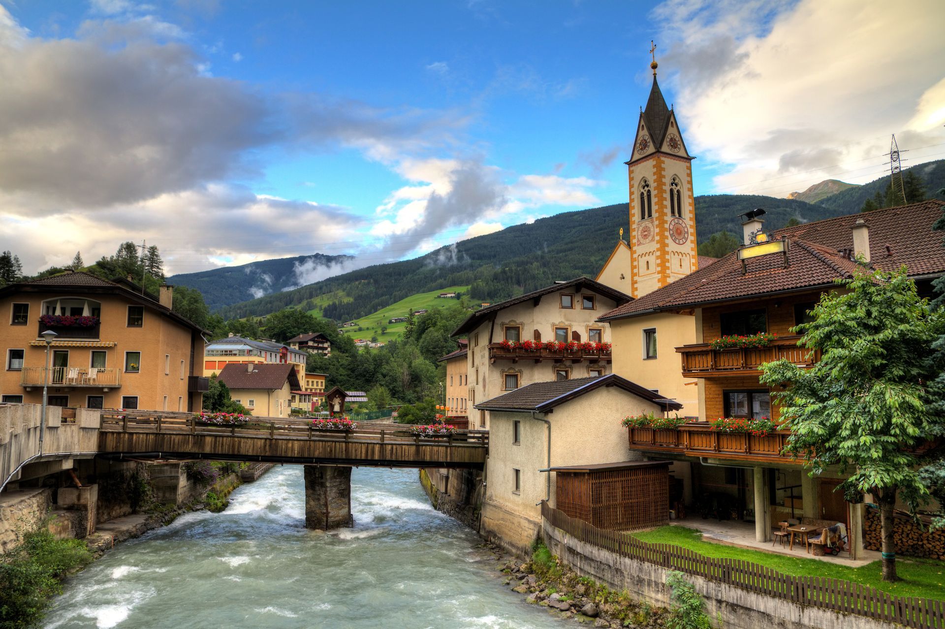 Beautiful small village with a river in the European alps