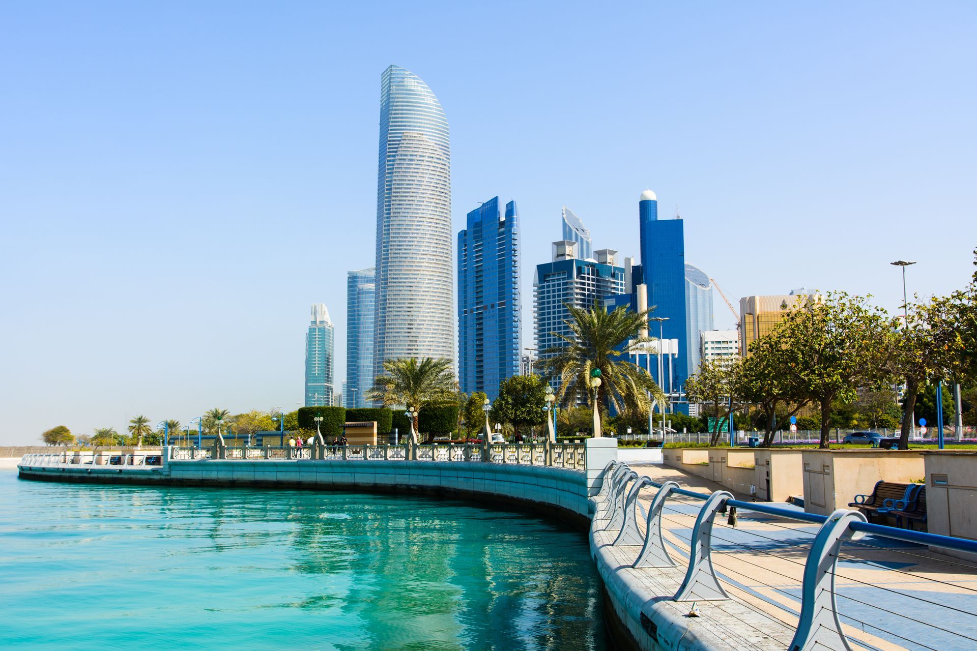 Modern buildings of downtown Abu Dhabi view from the walking area by the seaside