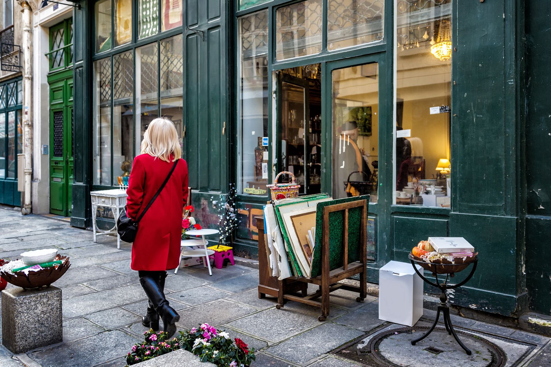 Paris street antique shop sidewalk shopper in red coat
