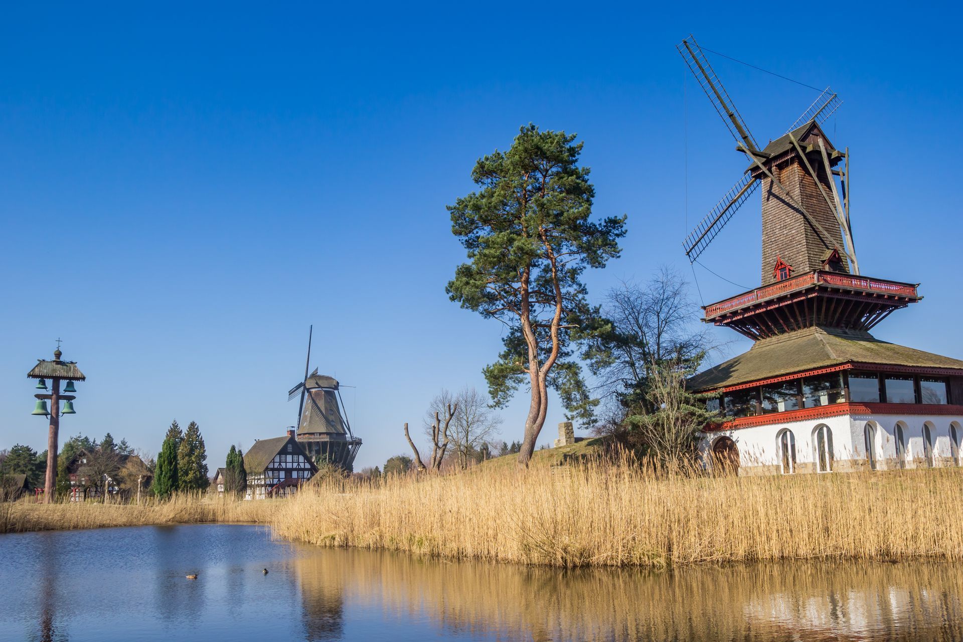 Historic windmills and half-timbered house at the lake in Gifhorn, Germany