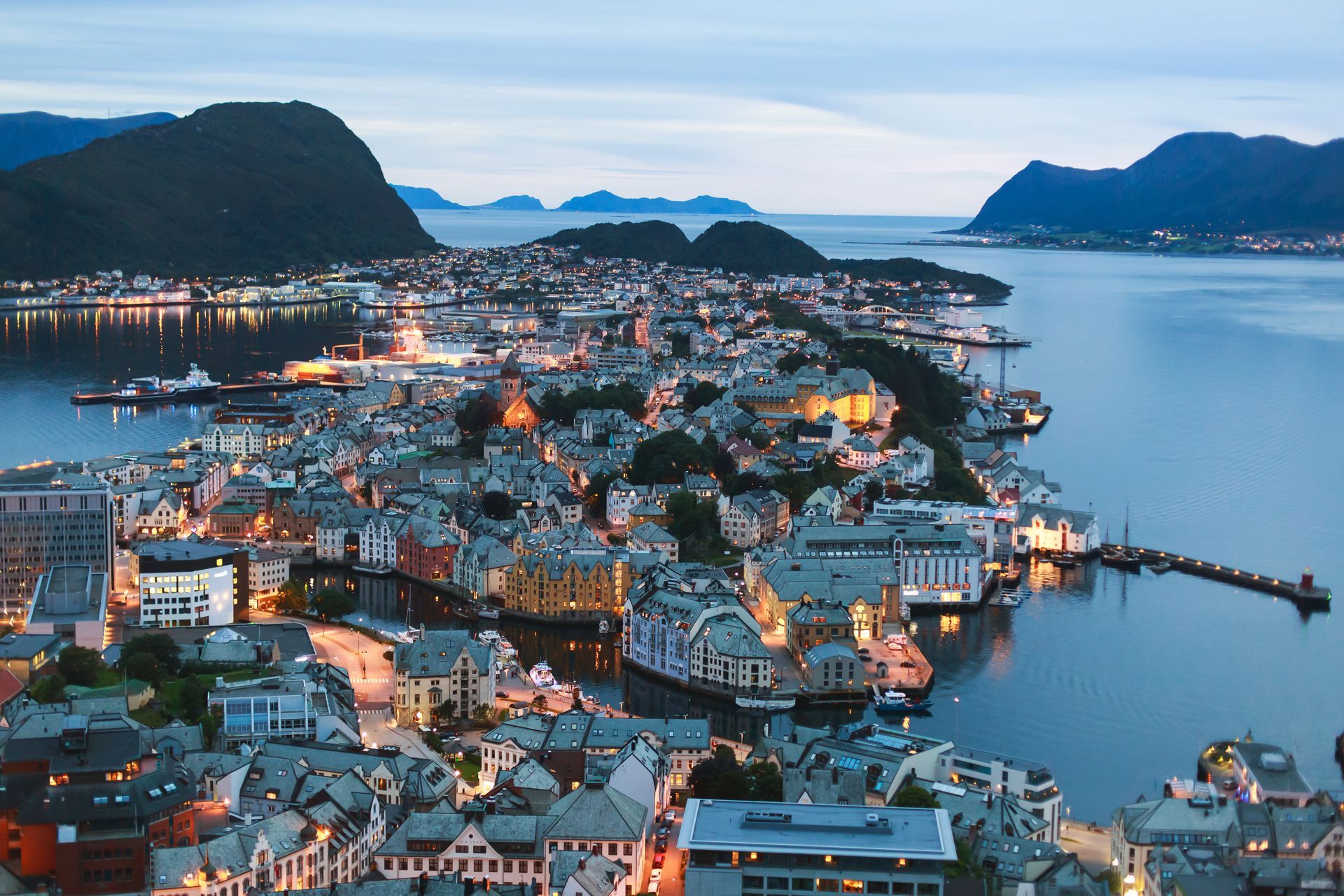 Beautiful super wide-angle summer aerial view of Alesund, Norway, with skyline and scenery beyond the city, seen from the observation deck of Aksla mountain
