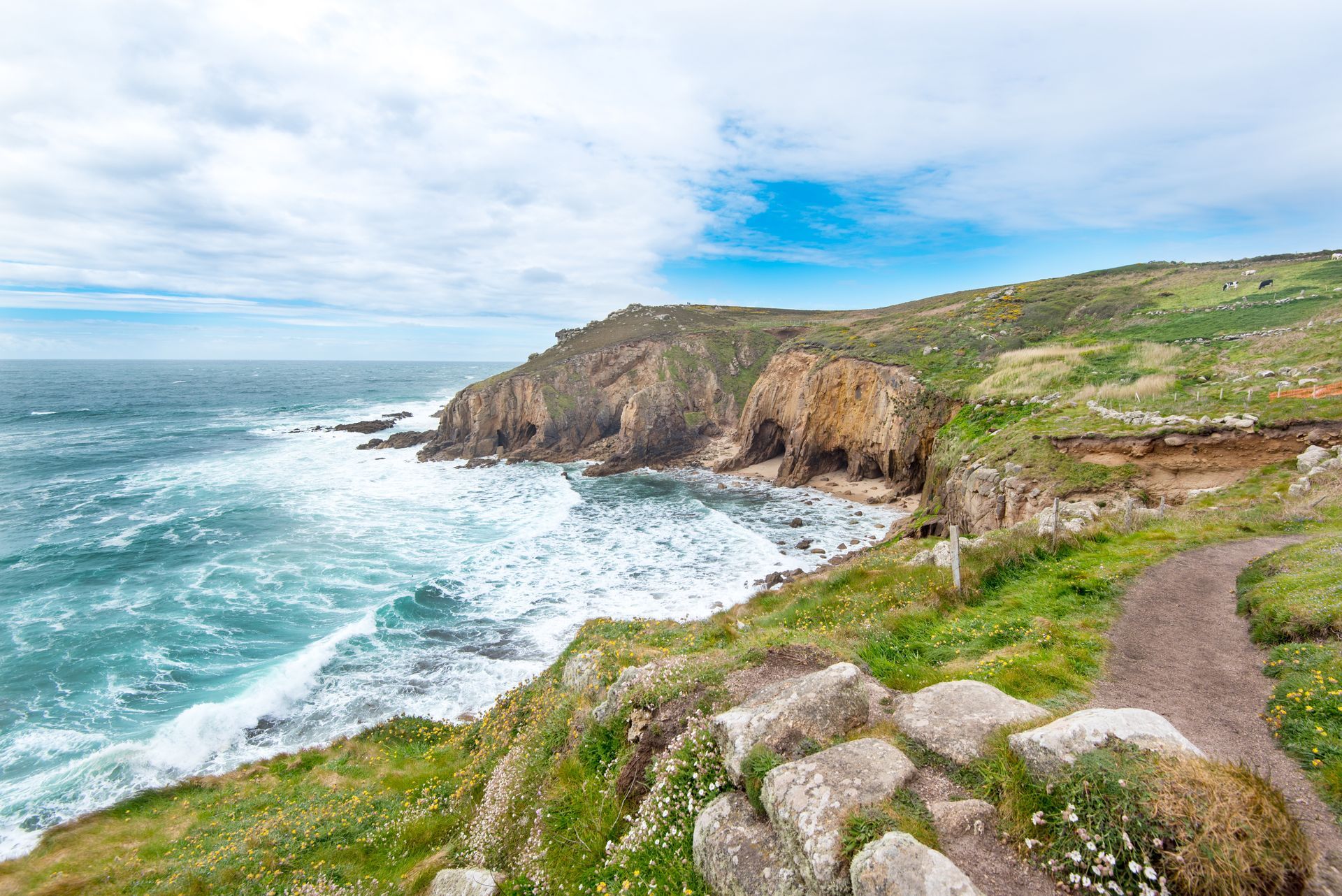 The Northern end of Mill Bay or Nanjizal is about 2km south of Lands End, Cornwall, UK. The rock known as Diamond Horse can be seen in the middle of the cliffs.