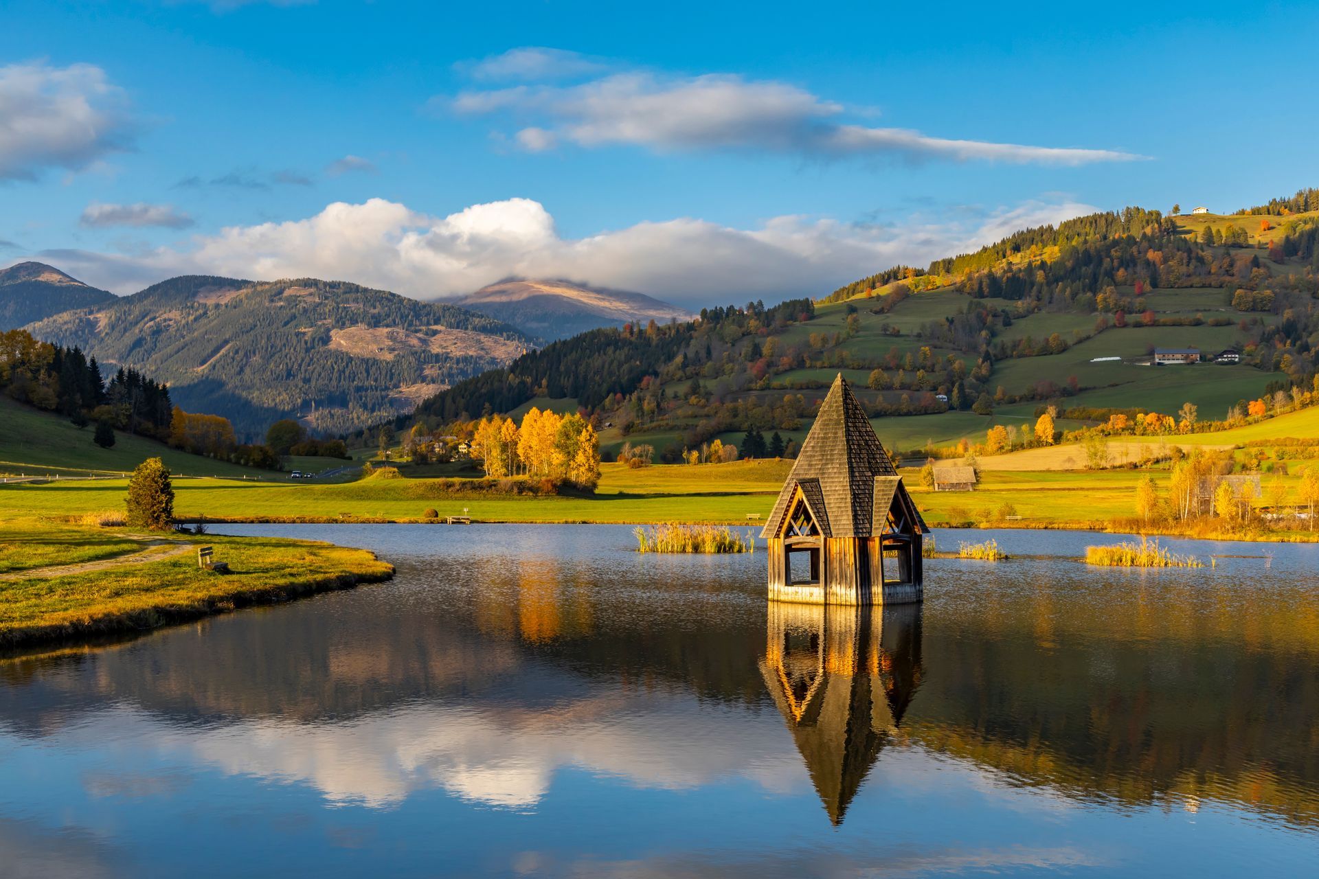 autumn pond under the mountains, Murau district,.Styria, Austria